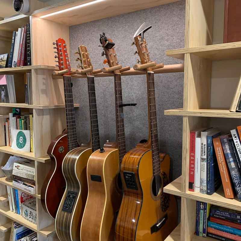 Custom guitar stand integrated into The Shelves