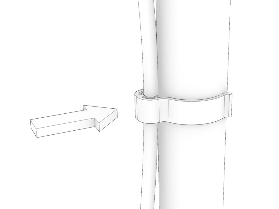 A KittaParts cable clip pressed onto a dowel with a power cable held in the clip