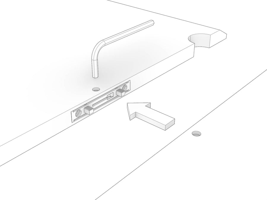 Two shelves being brought together on a flat surface with the Clamex fittings aligned, Allen key ready